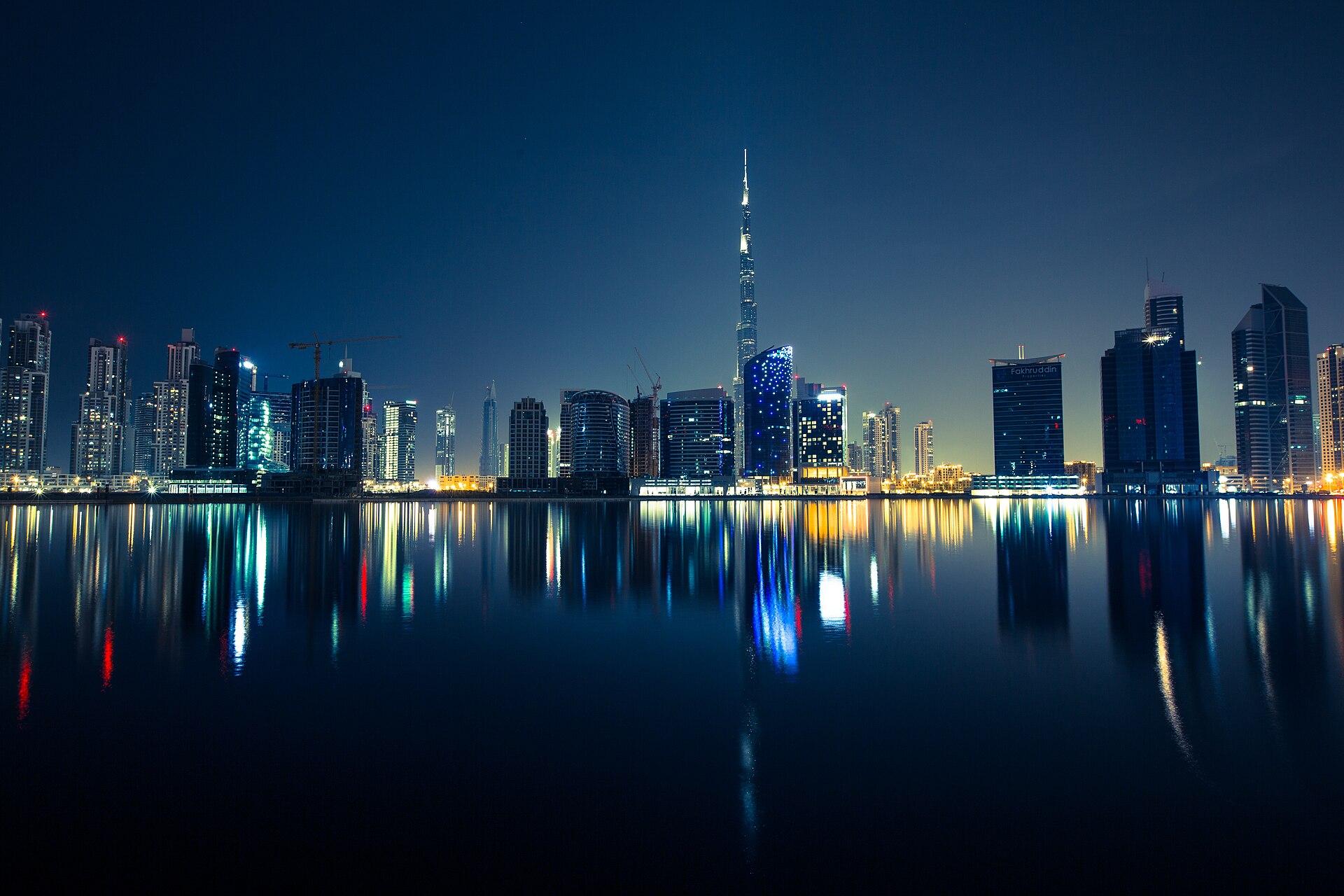 Dubai skyline at night with traffic